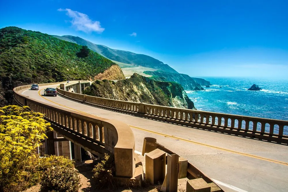 Coastal road winding along cliffs beside the ocean