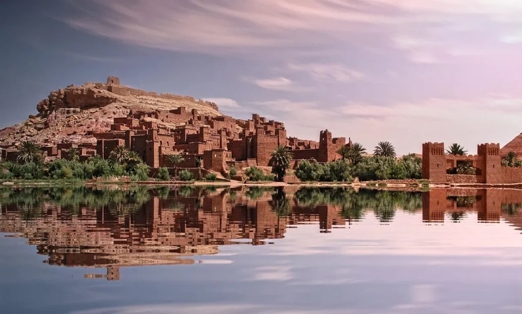 Ancient desert fortress reflected in a calm river