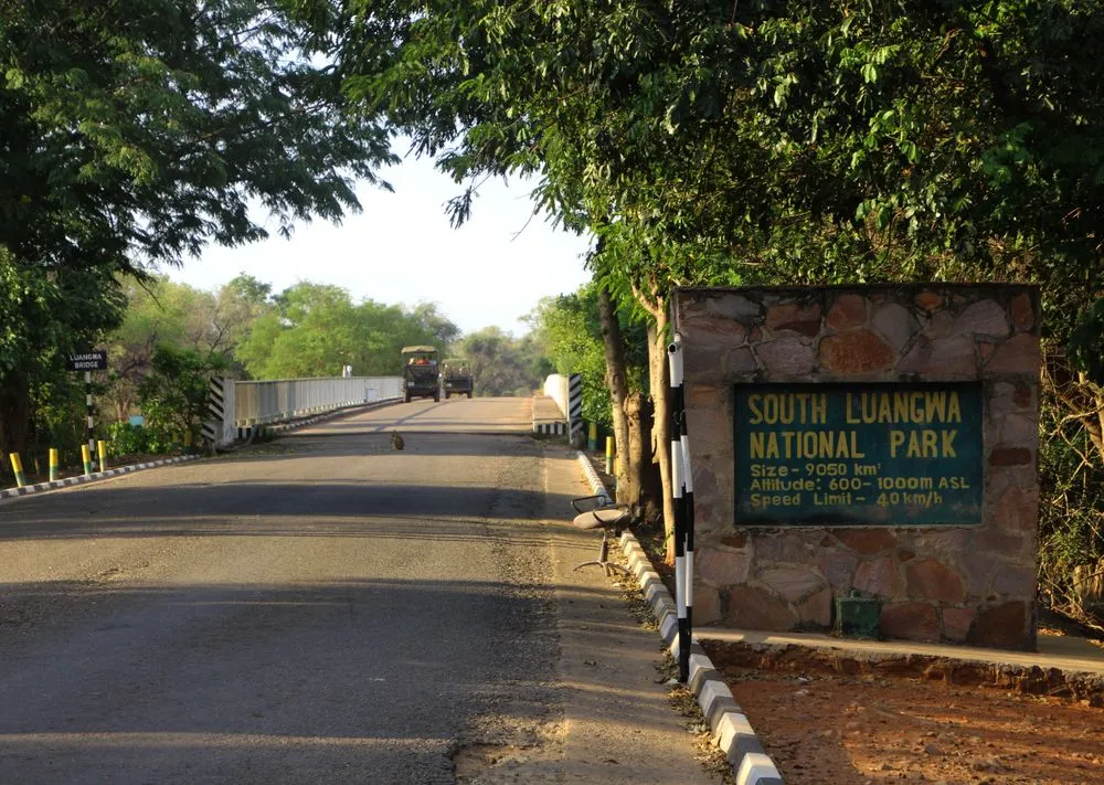 Entrance to South Luangwa National Park with road and park sign